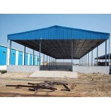Open steel truss shed with blue roof