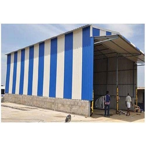 Large industrial steel shed with blue and white corrugated roofing built by Tanzeel Fabrication Works
